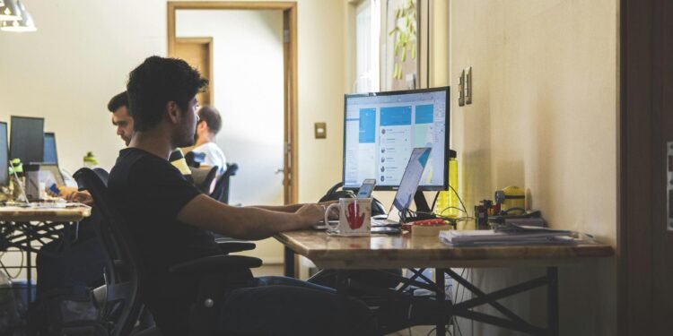 A desktop monitor with accounting software, highlighting the importance of sales proposal templates for businesses